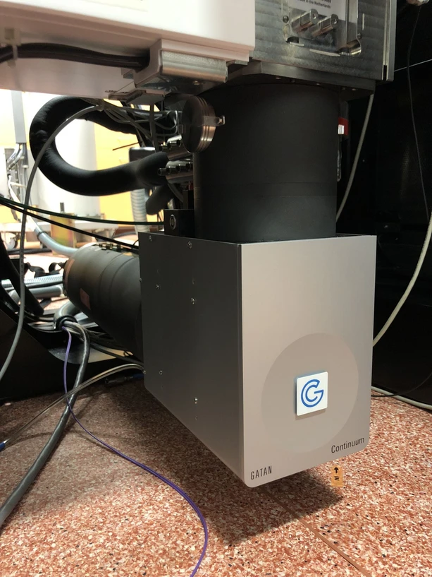 CEITEC/CEITEC BUT archive: Upgrade of TITAN transmission electron microscope ranks CEITEC among elite laboratories: Installation of the spectrometer beneath the microscope, magnetic prism.
