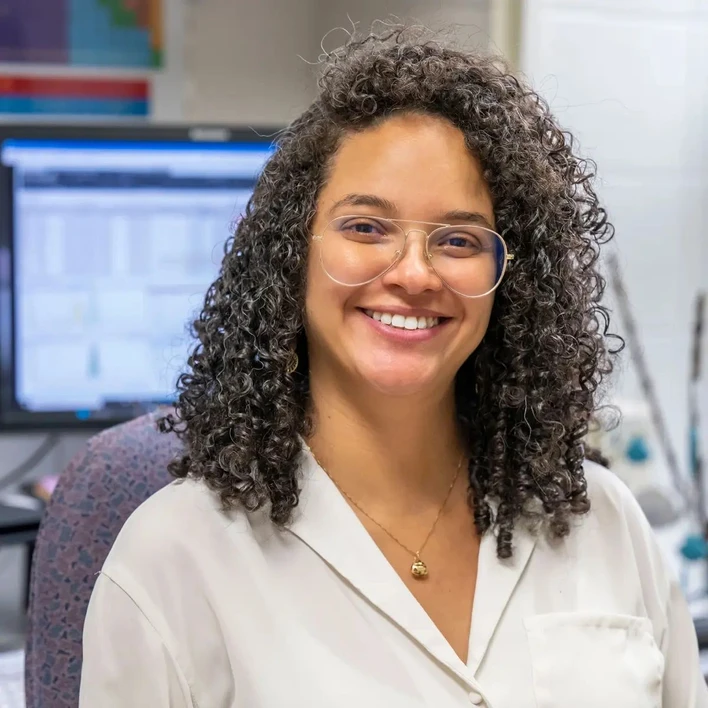 University of Notre Dame / Matt Cashore, Barbara Johnston:  A portrait of Daniele Miranda wearing glasses and a white lab coat. Assistant Research Professor Daniele Miranda.