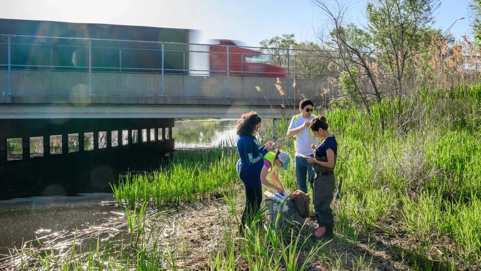 University of Notre Dame / Matt Cashore, Barbara Johnston: Daniele Miranda and graduate students (left to right) Alison Zachritz, Anthony Miller and Babita Bhatta prepare to take water samples from the Grand Calumet River in Hammond, Indiana.
