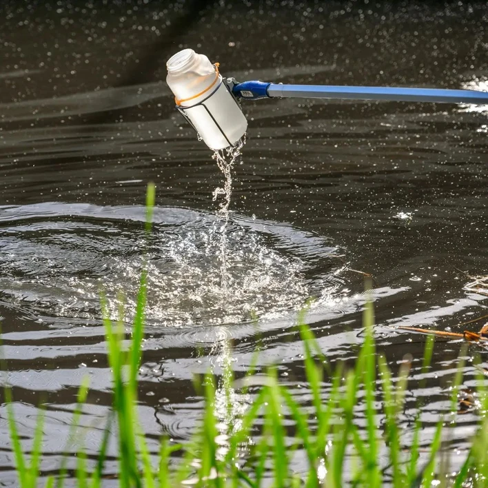 University of Notre Dame / Matt Cashore, Barbara Johnston: Daniele Miranda and her graduate students take water samples from the Grand Calumet River in Hammond, Indiana.