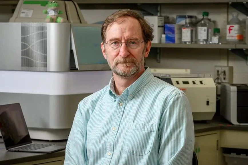 University of Notre Dame / Matt Cashore, Barbara Johnston: Working with Gary Lamberti, Michael Pfrender (pictured), director of Notre Dame's Genomics and Bioinformatics Core Facility, is studying how PFAS impacts gene expression in Lake Michigan fish.