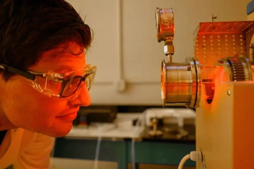 University of Notre Dame / Matt Cashore: Charbel Abou Khalil, a postdoctoral research associate in Doudrick’s lab, monitors a bench-scale incinerator used to simulate a full-scale hazardous waste incinerator.