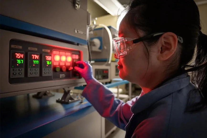 University of Notre Dame / Matt Cashore: Menglin (Mae) Jiang monitors the bench-scale incinerator in Doudrick’s lab.