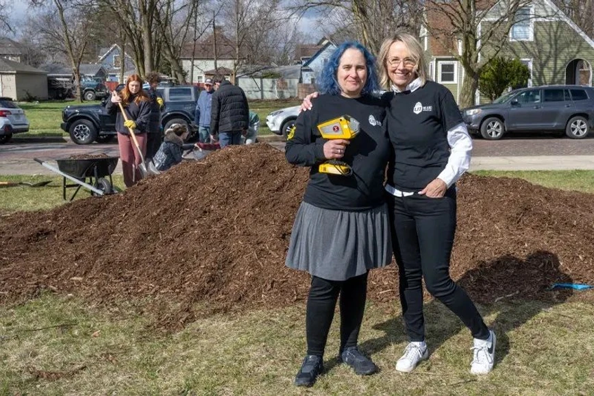 University of Notre Dame: Marya Lieberman works alongside fellow Notre Dame Lead Innovation Team member and founding member Heidi Beidinger during a Mulch Madness event. Spreading mulch helps prevent lead poisoning by sequestering chips from lead-based paint in the soil.